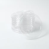 Stack of clear 95mm PP plastic sip lids with a drink aperture/closure, designed for securing hot beverages and cold drinks. Bulk case of 1000 pieces.