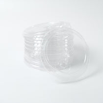 Stack of clear 95mm PP plastic sip lids with a drink aperture/closure, designed for securing hot beverages and cold drinks. Bulk case of 1000 pieces.