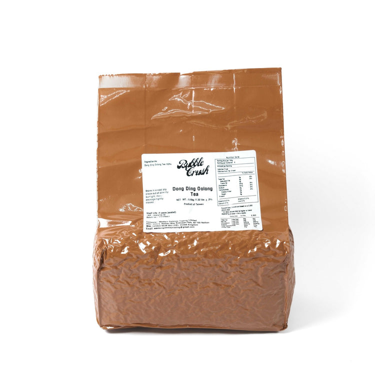 Premium Taiwanese Qingxin Oolong loose leaf tea in a 500g wholesale bag, showing the twisted, dark green tea leaves.