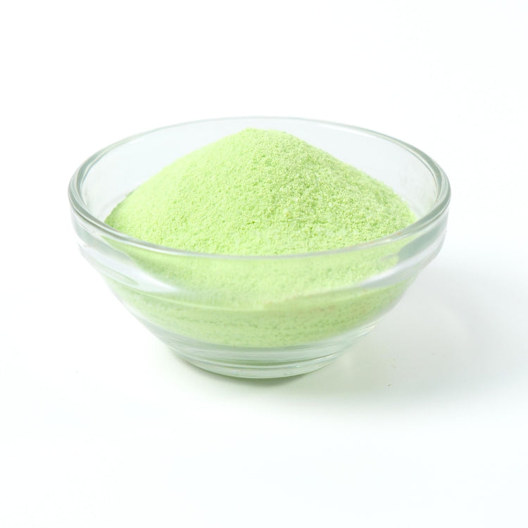 Refreshing light green Honeydew milk tea drink being prepared instantly from the rapid-dissolve powder.