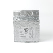 Clear, pale green Jasmine Green Tea infusion, highlighting the fresh quality and floral aroma of the loose leaf