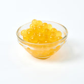 Premium Vegan Mango Popping Pearls, versatile dessert and smoothie topping manufactured in Taiwan.