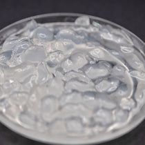 A close-up view of translucent crystal boba pearls, commonly used in bubble tea and other beverages.