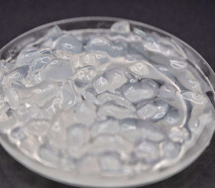 A close-up view of translucent crystal boba pearls, commonly used in bubble tea and other beverages.