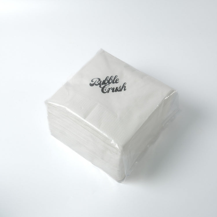 Premium napkin placed next to a bubble tea drink, demonstrating suitability for café and quick service use.