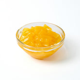 Premium Passion Fruit Nata de Coco Cubes, vibrant yellow dessert and bubble tea topping for home and bulk orders.