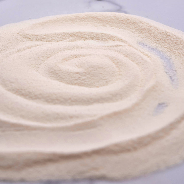 Thick, stable Pink Salt Milk Foam being prepared with the vegan powder mix, perfect for topping drinks.