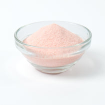 Light pink Strawberry milk tea drink being prepared instantly from the rapid-dissolve powder base.