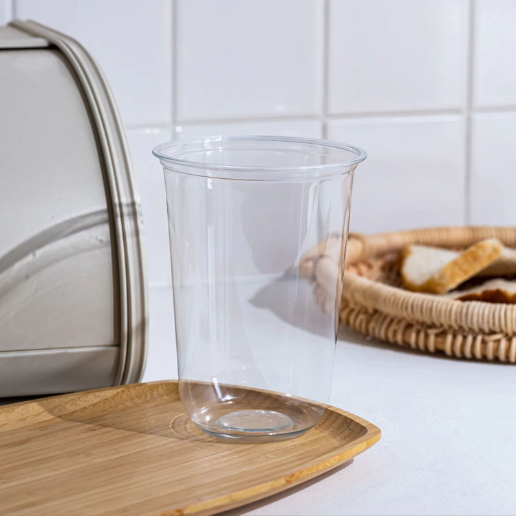 Bulk stack of durable, clear 95mm PP plastic cups in 500cc and 700cc sizes, ready for custom logo printing for bubble tea and hot/cold drink takeaway.