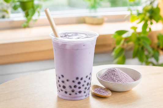 Pastel taro bubble milk tea with tapioca pearls and taro powder in a bright UK café