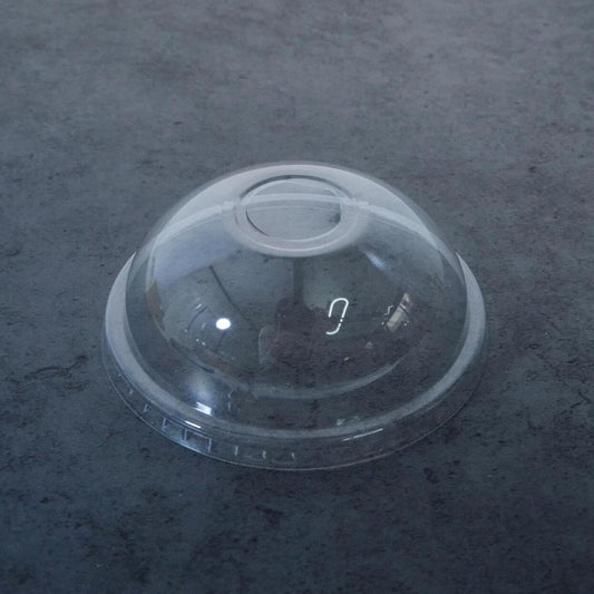 Clear 95mm Bubble Crush PP plastic dome lids with a straw hole, packaged in a bulk case of 1000 units, designed for use with hot drinks, smoothies, and bubble tea cups.