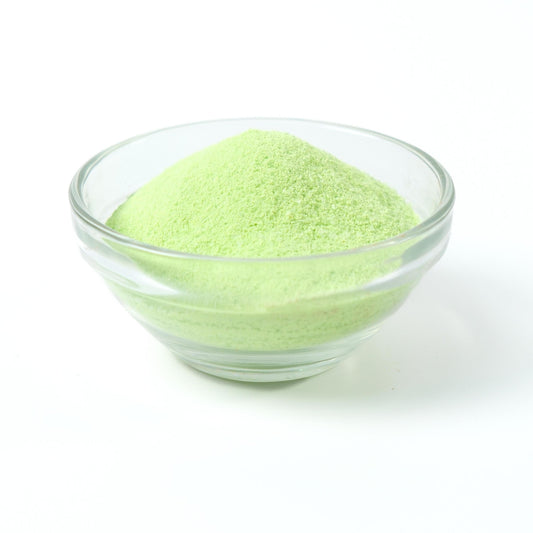 Refreshing light green Honeydew milk tea drink being prepared instantly from the rapid-dissolve powder.