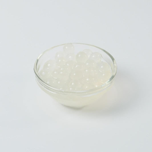 Wholesale Lychee Popping Boba Pearls (3.2KG), exotic and refreshing topping for UK bubble tea bulk supply.