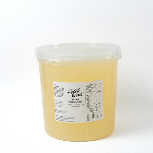 Close-up of Lychee Popping Boba, juicy and ready-to-use pearls for high-volume foodservice topping.
