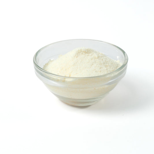 Refreshing Lychee milk tea drink being prepared instantly from the rapid-dissolve powder, showing light pink colour.