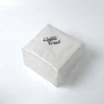 Premium napkin placed next to a bubble tea drink, demonstrating suitability for café and quick service use.