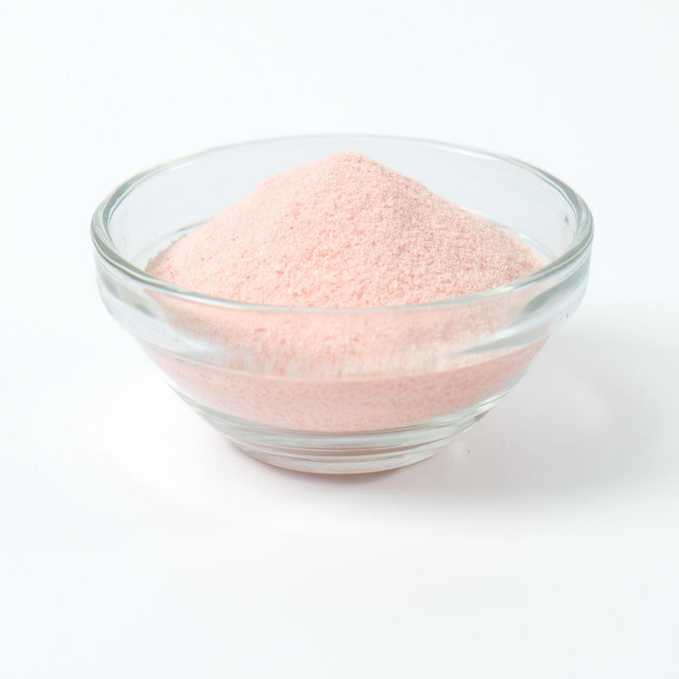 Light pink Strawberry milk tea drink being prepared instantly from the rapid-dissolve powder base.