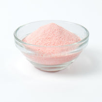Light pink Strawberry milk tea drink being prepared instantly from the rapid-dissolve powder base.