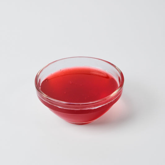 Finished Strawberry Iced Tea or milkshake, showcasing the sweet, classic fruit flavour and red colour of the syrup.