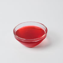 Finished Strawberry Iced Tea or milkshake, showcasing the sweet, classic fruit flavour and red colour of the syrup.