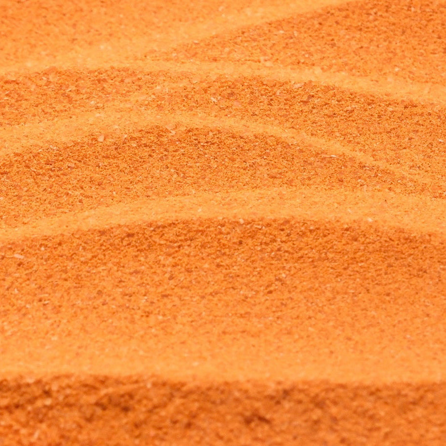 Vibrant orange Thai Milk Tea drink with a creamy smooth texture, made instantly from the powder mix.