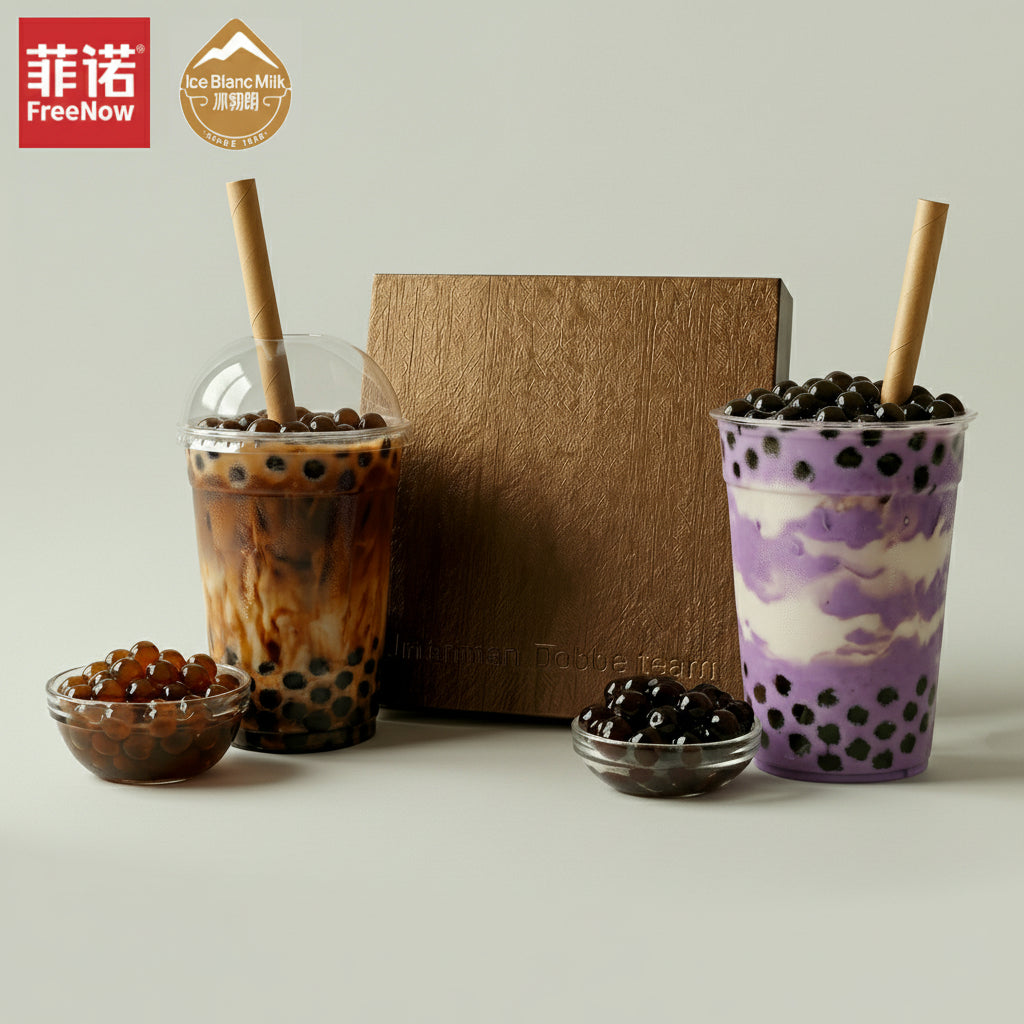 Two bubble tea drinks with ingredients on a light surface, featuring the FreeNow logo.