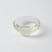 Finished Lychee Iced Green Tea or sparkling water, showcasing the refreshing and sweet Asian fruit flavour.